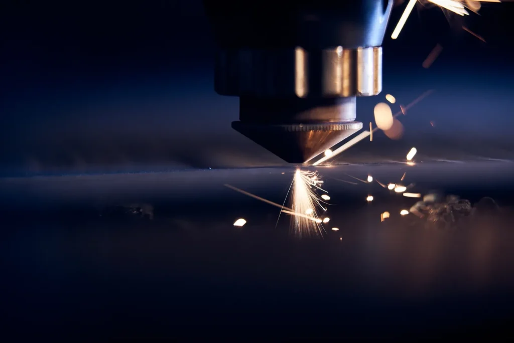 CNC cutting process with sparks, highlighting precision metalworking for thin-wall components.