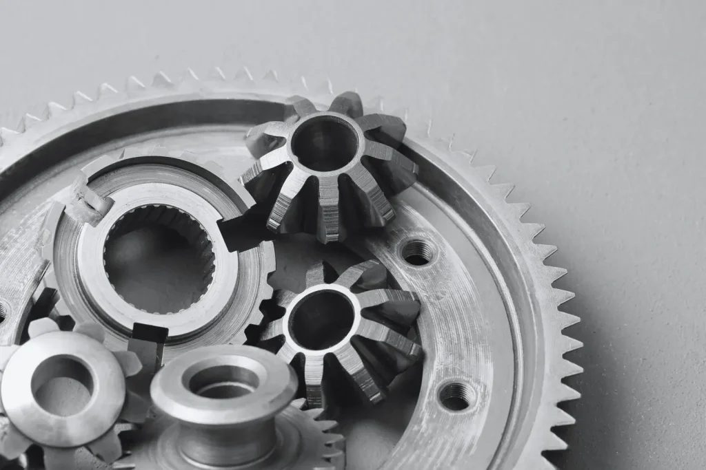 Precision CNC machined bevel gears and components, showcasing thin-wall metal part production.