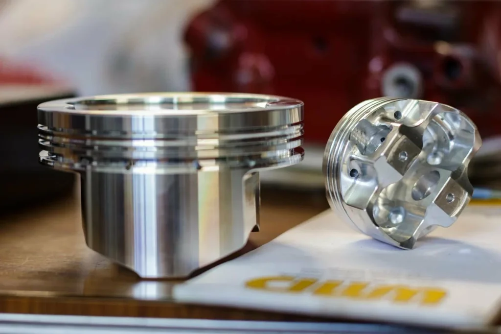 Precision-machined metal pistons showcase the high-quality output of costed CNC manufacturing.