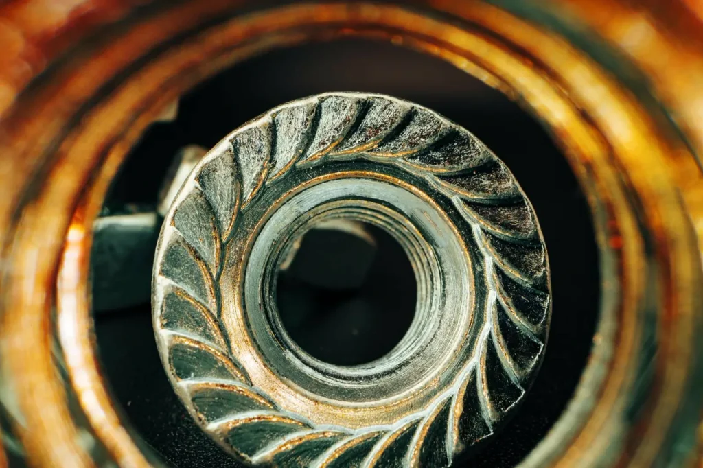 Close-up of a precision-machined metal component, highlighting the intricate surface details achievable through grinding or milling.