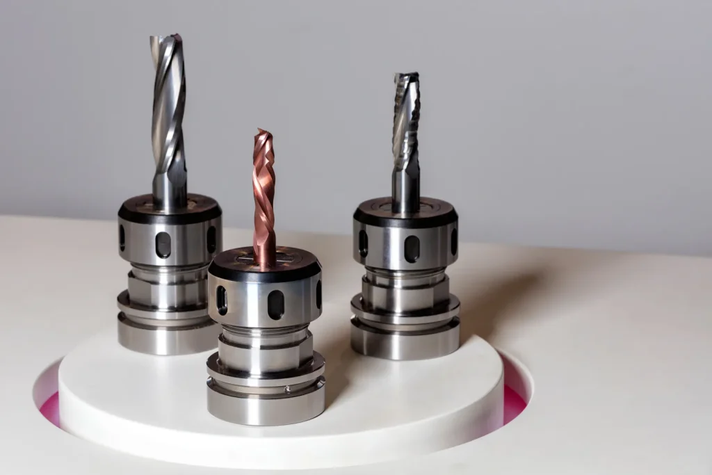 Three different industrial CNC cutting tools on display for machining aerospace-grade materials.