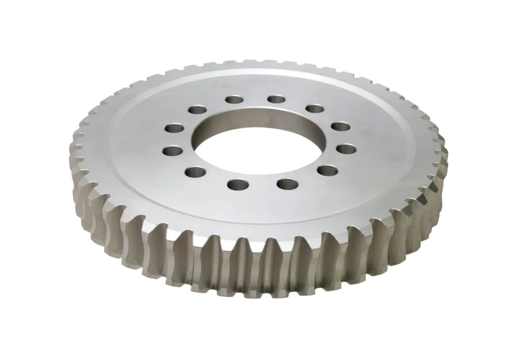 A finished gear part features precision holes made via CNC EDM drilling.