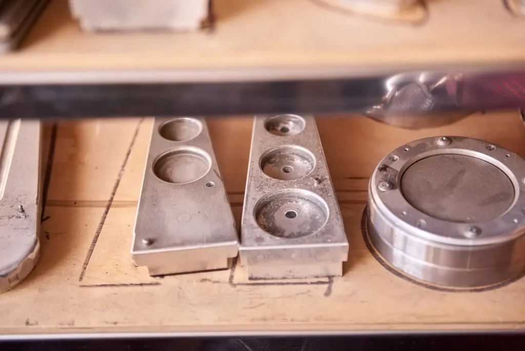 Workpieces with precision holes await further CNC EDM hole drilling operations.