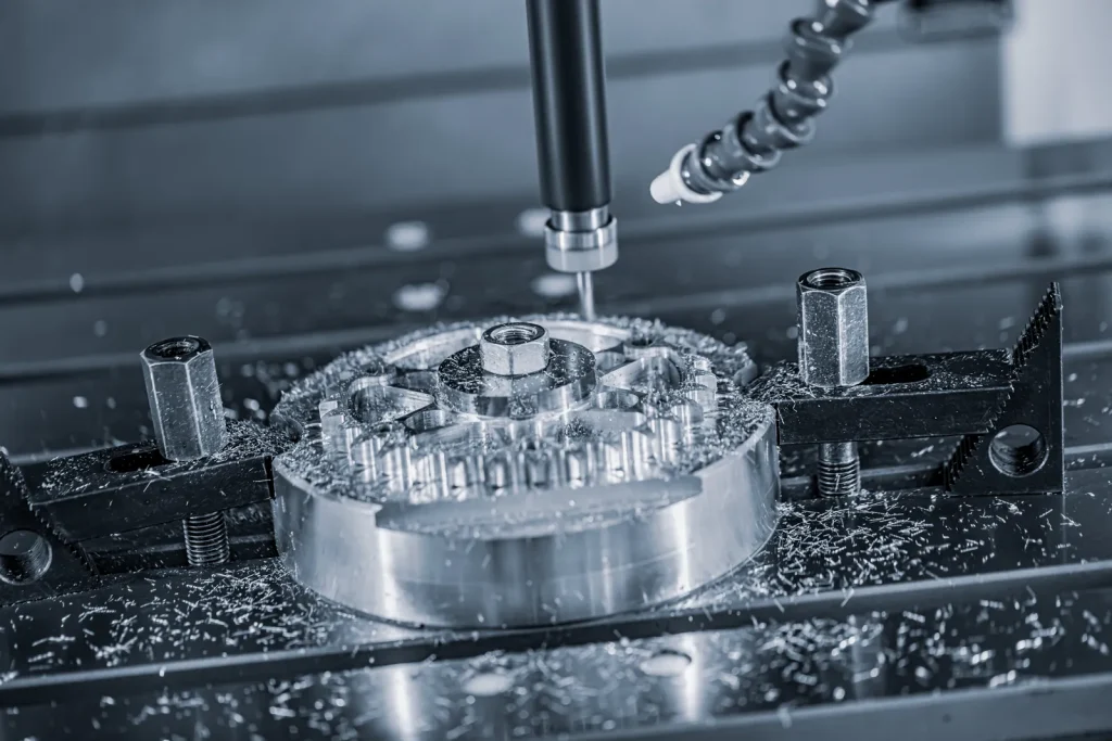 A high-speed CNC cutting tool mills a metal workpiece, creating fine chips.