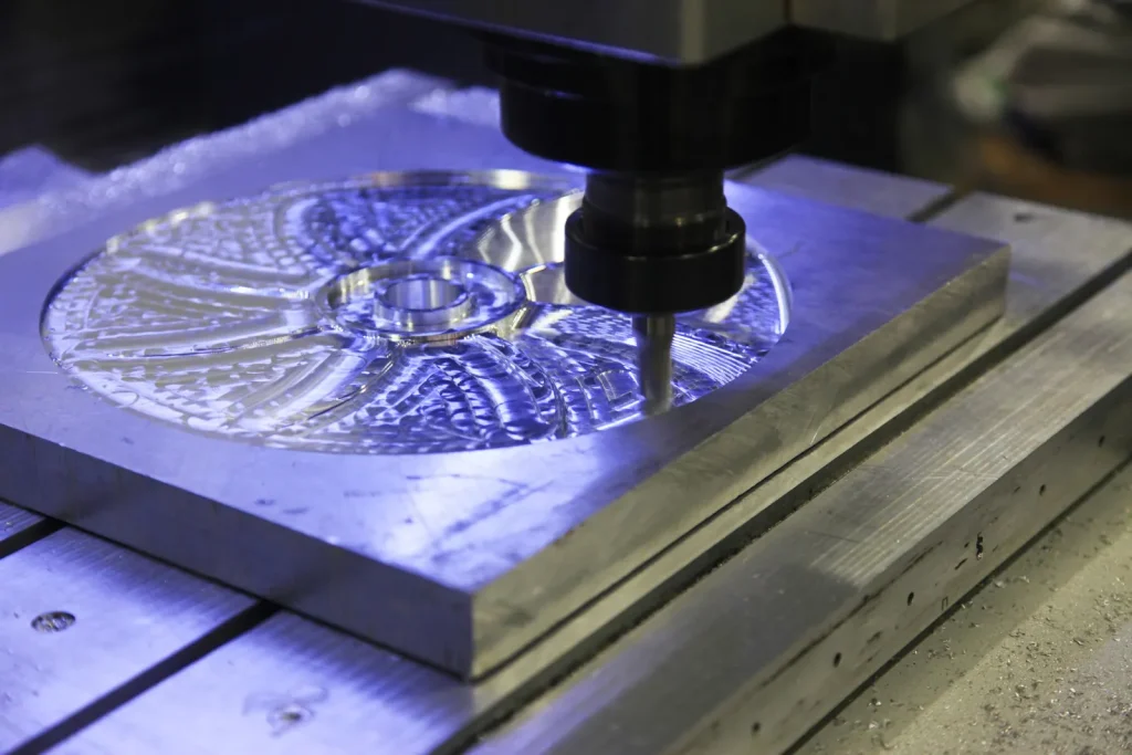 A micro CNC cutting tool engraves intricate patterns on a small workpiece.